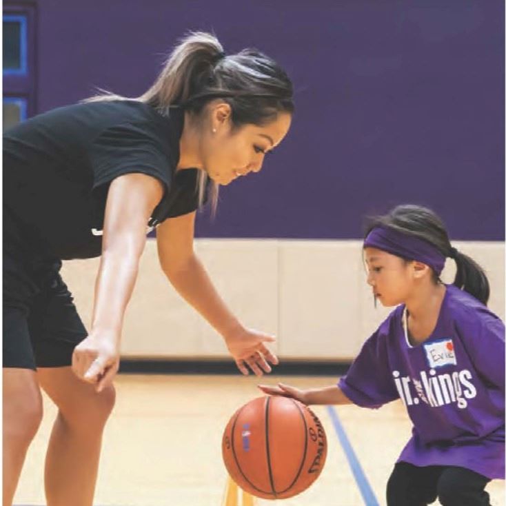 Descriptive flyer with girl playing soccer assisted by coach